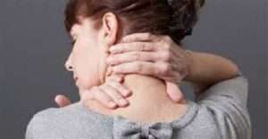 a lady with neck pain self massage her neck